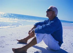 Older Man Sitting on Beach