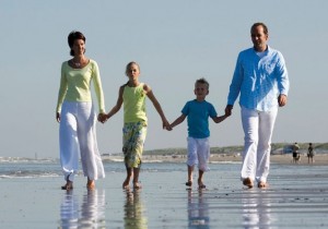 happy family walking along the beach; 's-Gravenzande, Netherlands